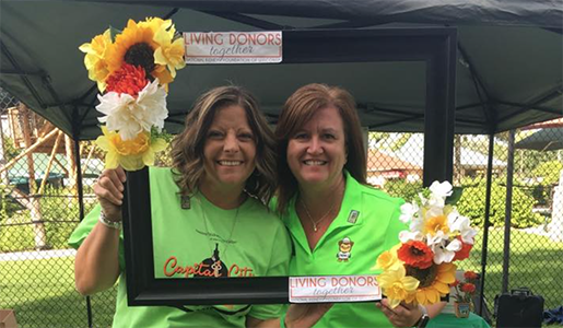 2 Living Donors standing together within a picture frame